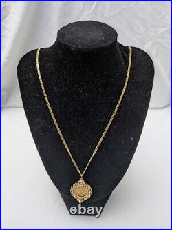 1911 22ct half sovereign mounted pendant with 9ct gold chain. 18.2 grams