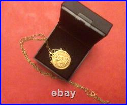 22ct GOLD HALF SOVEREIGN 1910 IN A 9ctGOLD MOUNT AND 9ct GOLD CHAIN