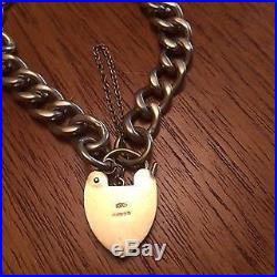 9ct GOLD, CURB CHAIN BRACELET, charm style, WITH PADLOCK. 35.2g