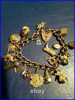 9ct Gold Vintage Charm Bracelet with 19 charms and safety chain 40grams
