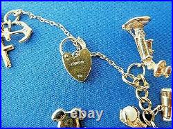 9ct Solid Hallmarked Gold Charm Bracelet 24 charms inc Padlock & chain 27.4 gm