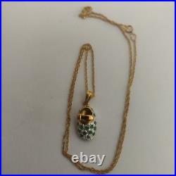 9ct gold & emerald shoe pendant hanging from 9ct gold chain